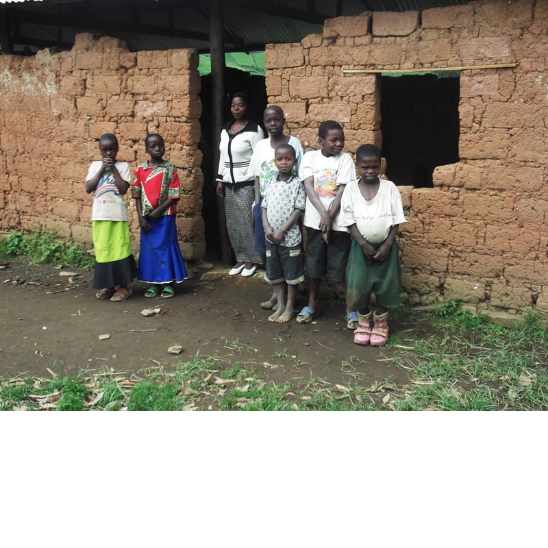 Teachers and pupils outside a classroom at Bikaniro